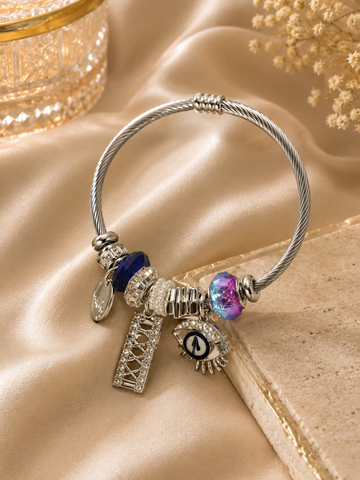 Luxury Charm Bracelet – Silver Evil Eye & Crown Charm Bangle